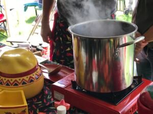 Steam rises from a pot of chili at a chili cook off